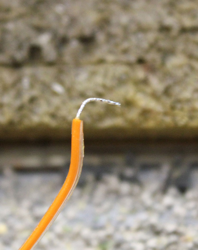 Bend lead to shape to fit end flat